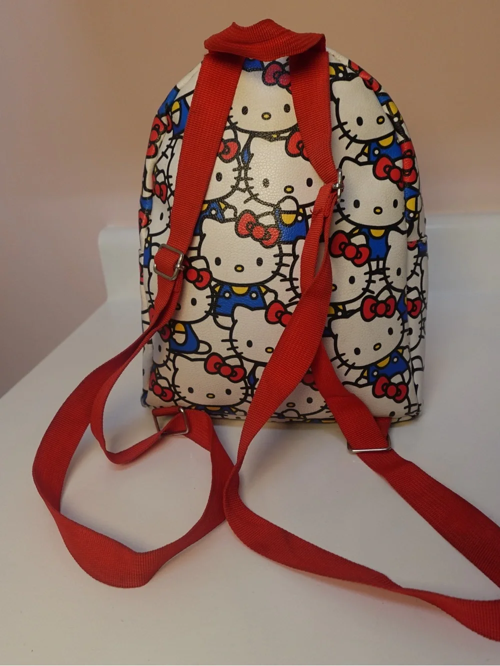 Hello Kitty White Backpack with Red Bows and Blue Outfits